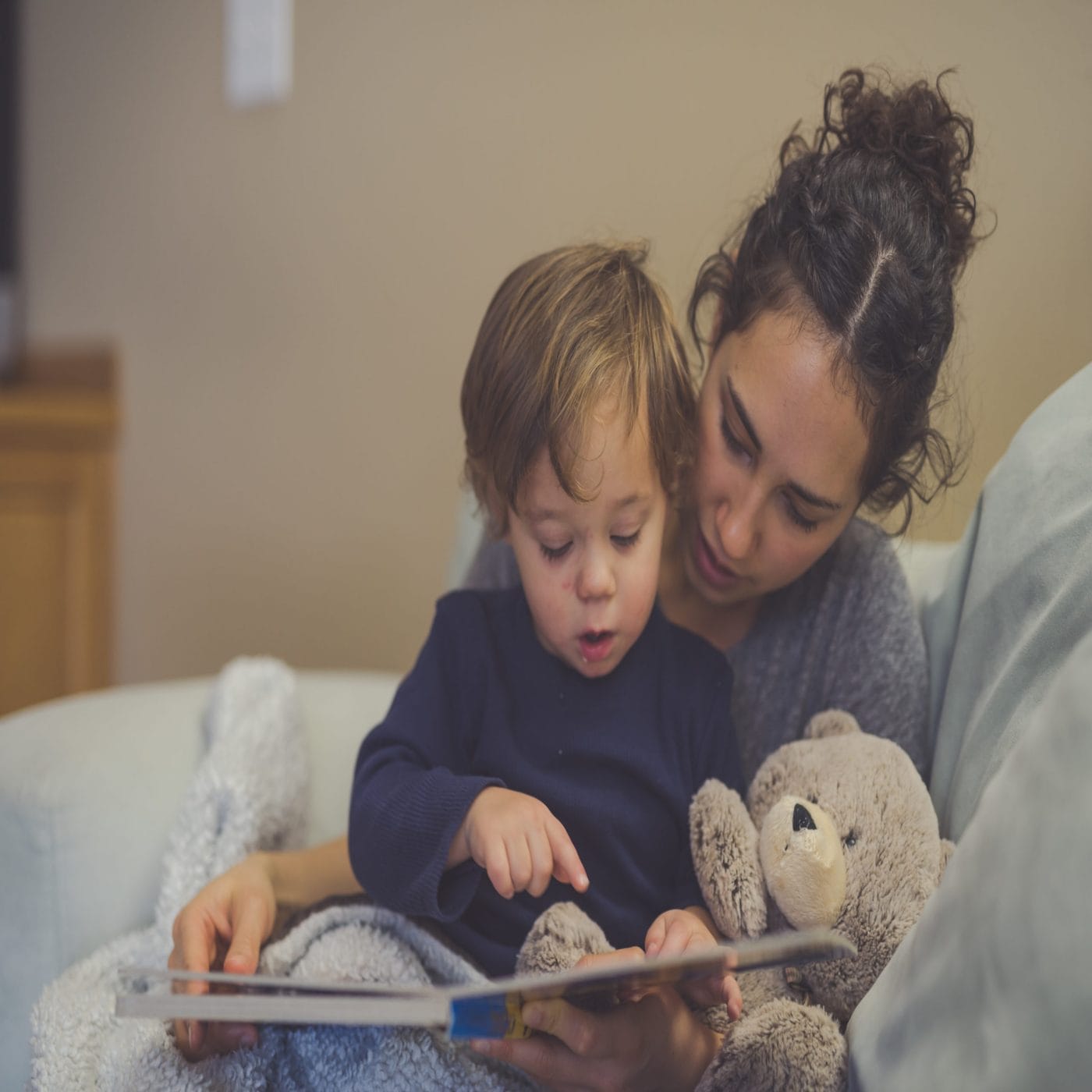 As a mother of Latinx children, I wanted more books that would inspire them so I wrote my own mom reading a book to a child - latinx children's books