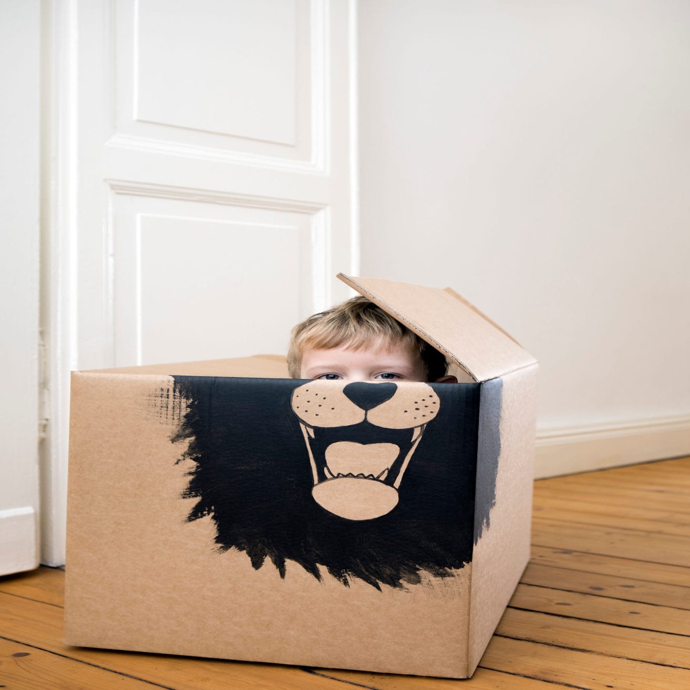 10 helpful phrases to say when your child struggles in social situations kid playing in a cardboard box