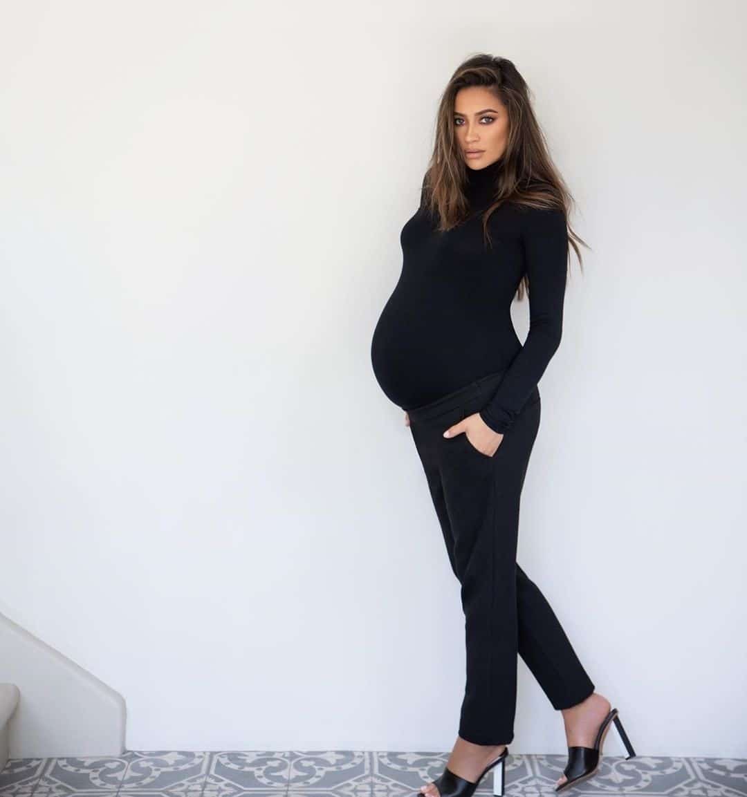 Shay Mitchell opens up about her mental health during pregnancy Pregnant Shay Mitchell against a white wall