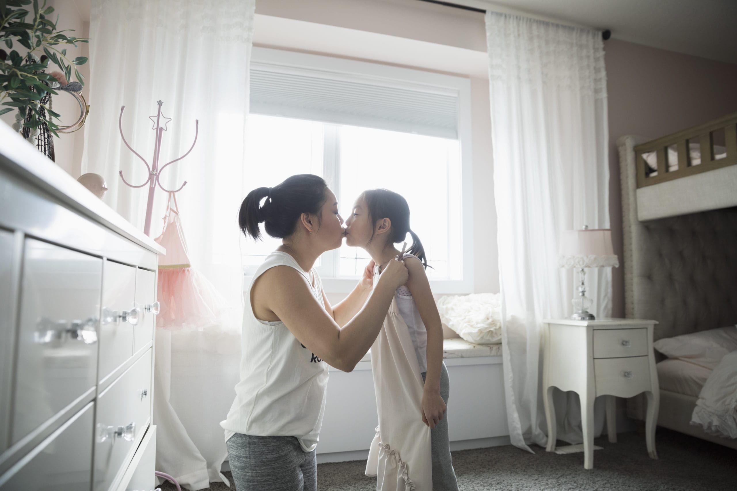 I’m defined by motherhood right now, and that’s okay mom and daughter kissing
