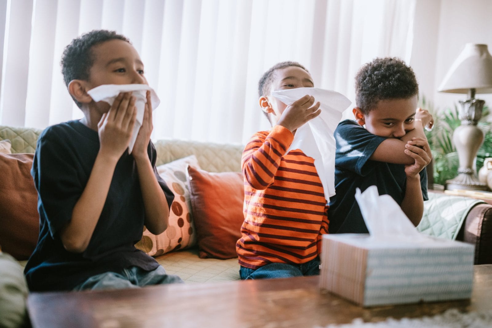 Do cold remedies really work? What to know this cold & flu season, mama three kids blowing their noses