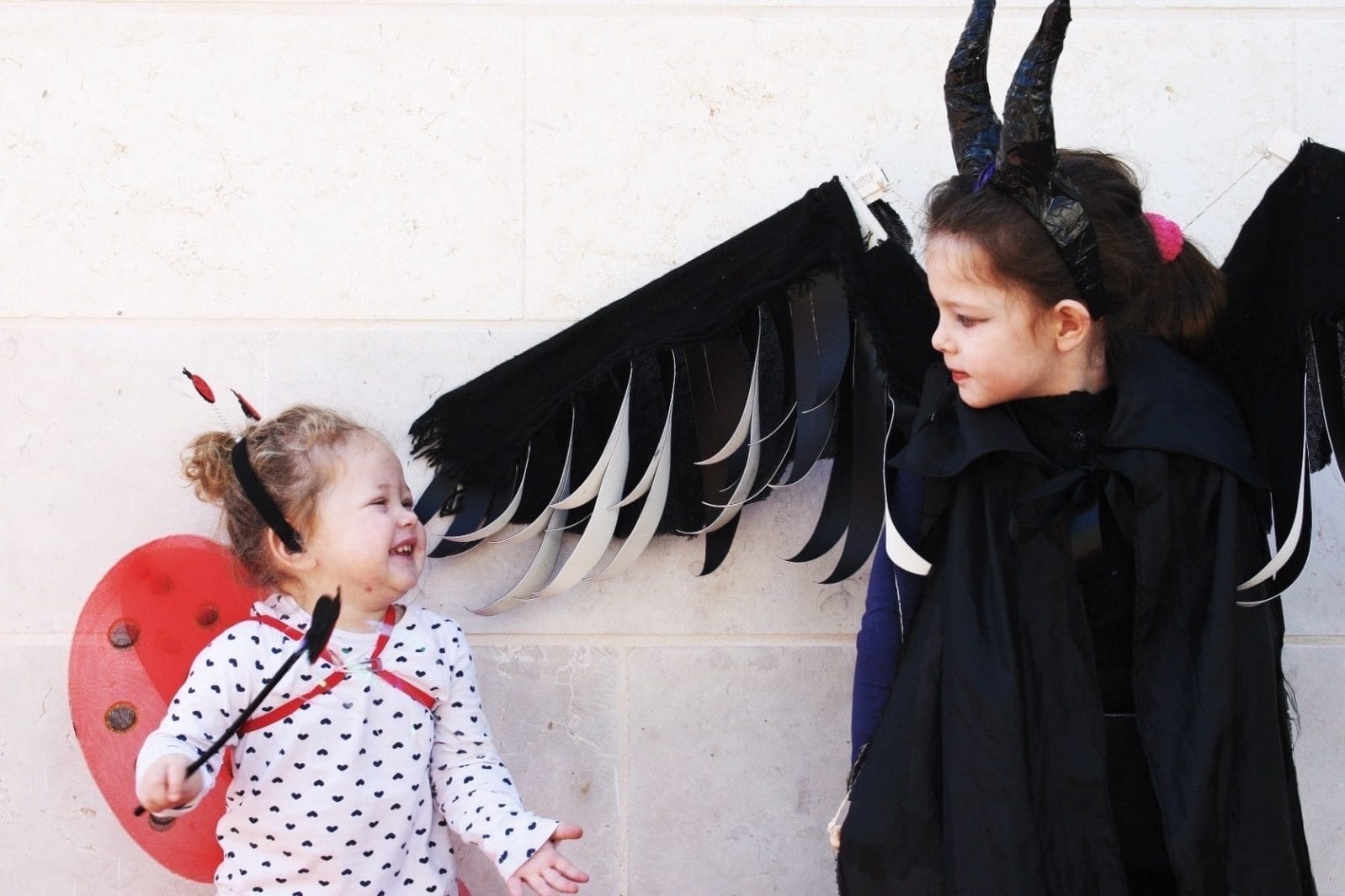 Should Halloween be delayed for bad weather? two girls dressed up for Halloween