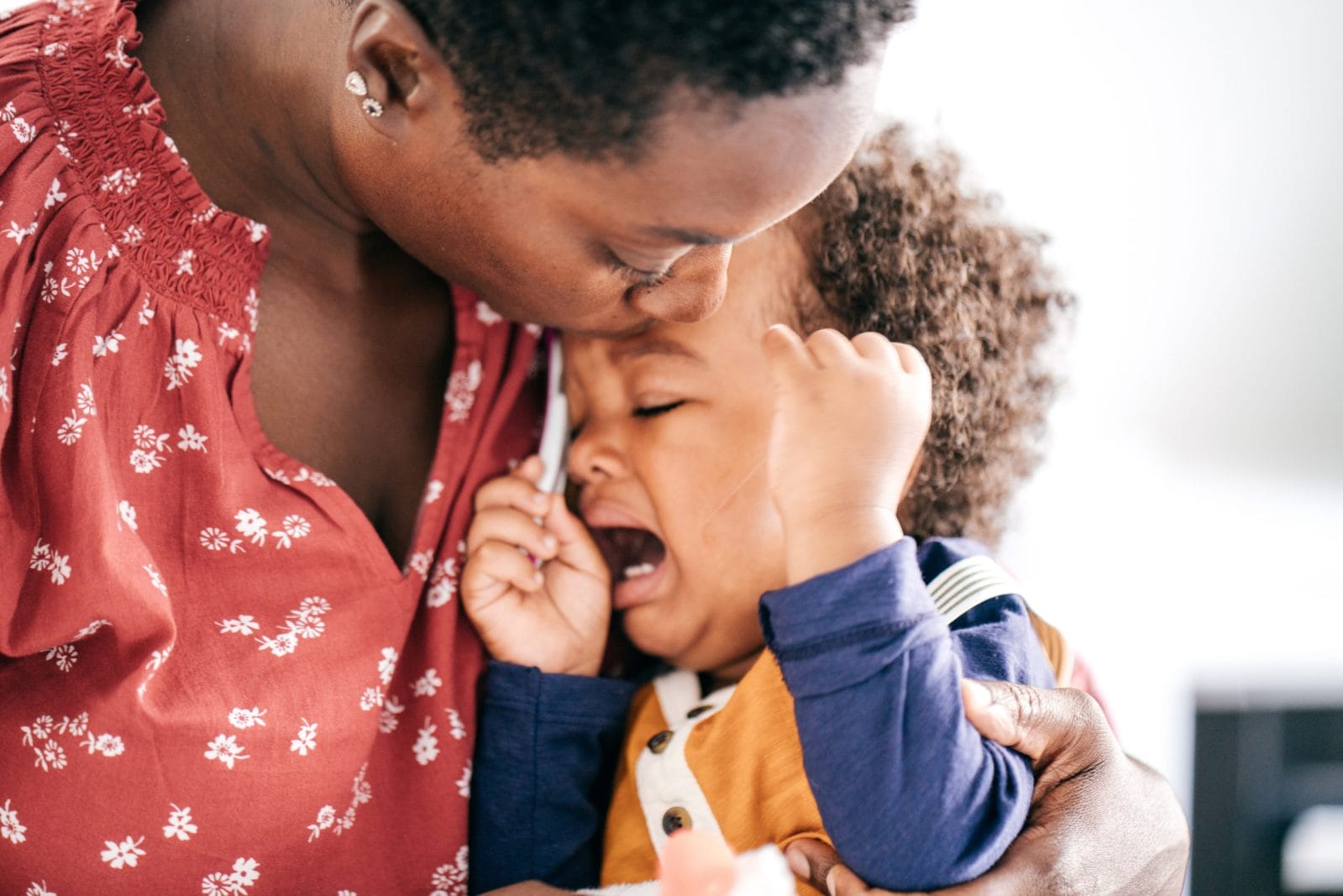 6 ways tantrums can bring you closer to your toddler, mama mom consoling a crying child