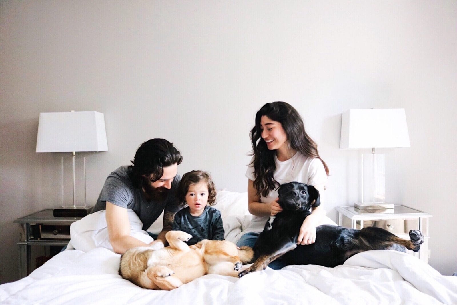 How to create a happy & peaceful home for your family, mama family sitting on a bed