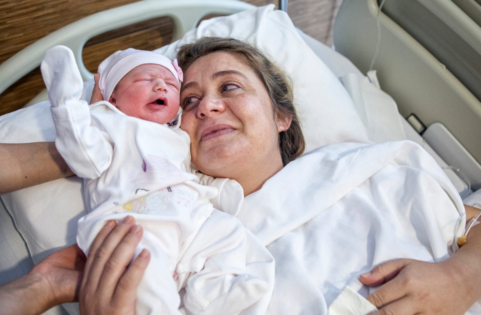 Why are birth rates declining in the US? mom holding newborn baby in spite of declining birth rates