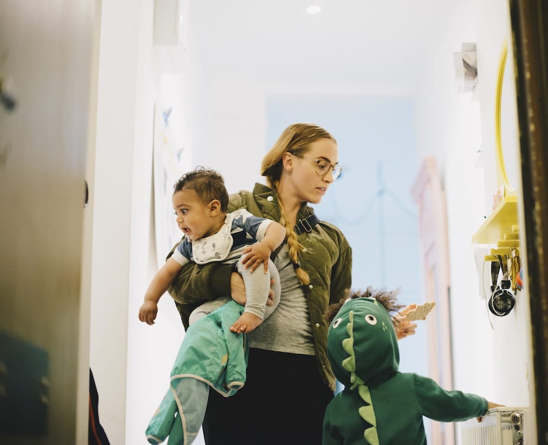 88% of parents say being a parent is harder than ever mom juggling two toddlers
