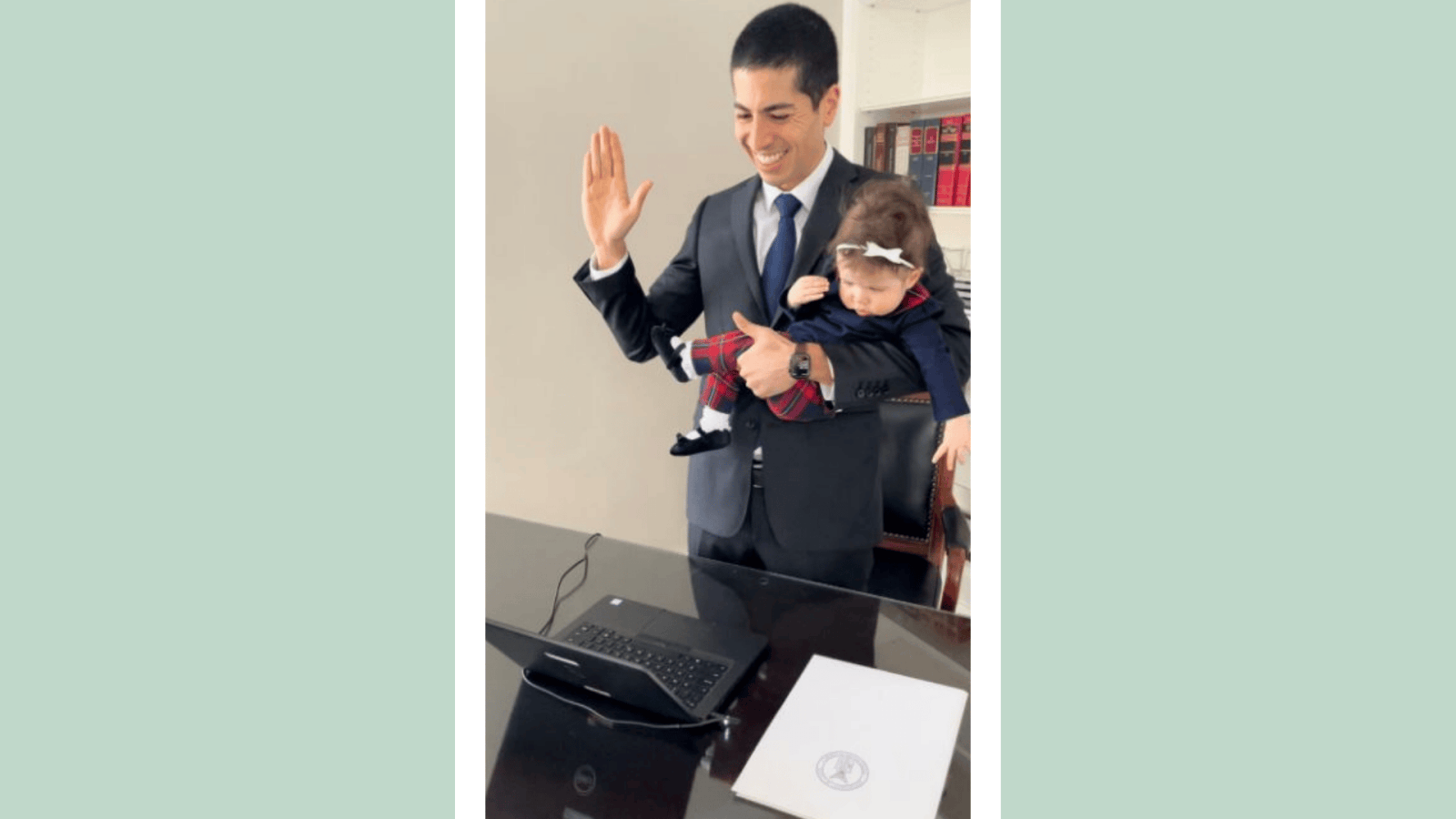 This dad holding his baby while being sworn in at the Department of Labor is everything