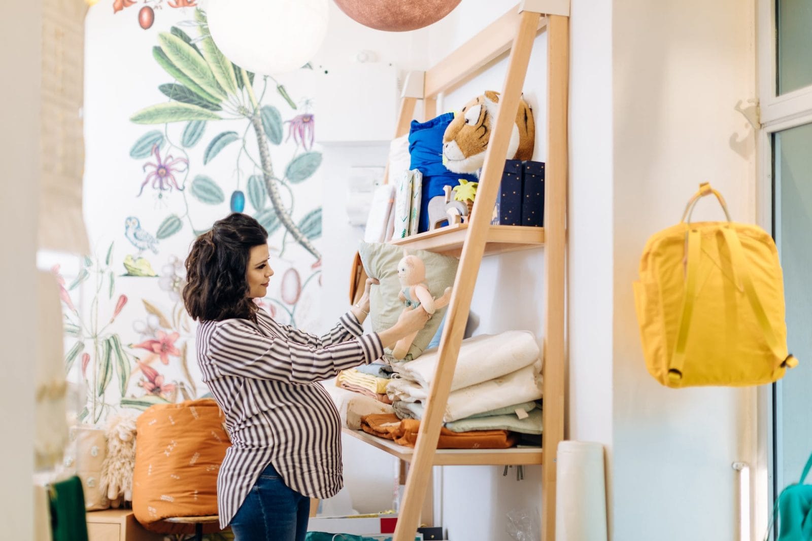5 must-know tips to help you create the perfect baby registry pregnant woman picking out items for her baby registry