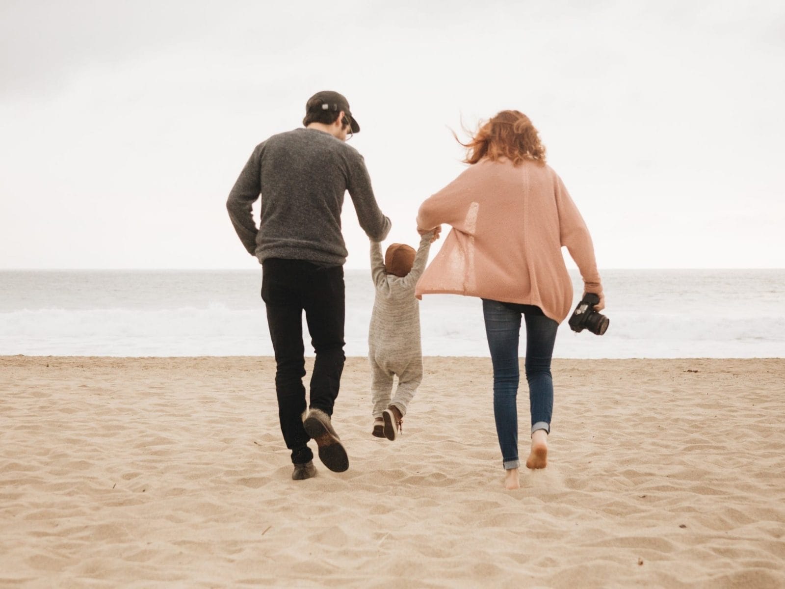 Parenting together: 6 tips for partners to be on the same page couple swinging toddler in the air