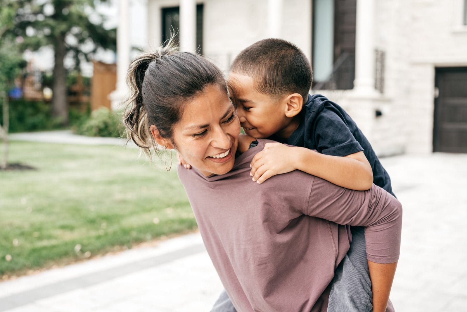 I saved so much mental energy when I quit social media mom carrying toddler on her back