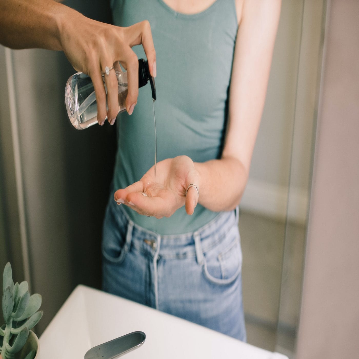 Poison control alert: Keep hand sanitizer away from kids woman using hand sanitizer