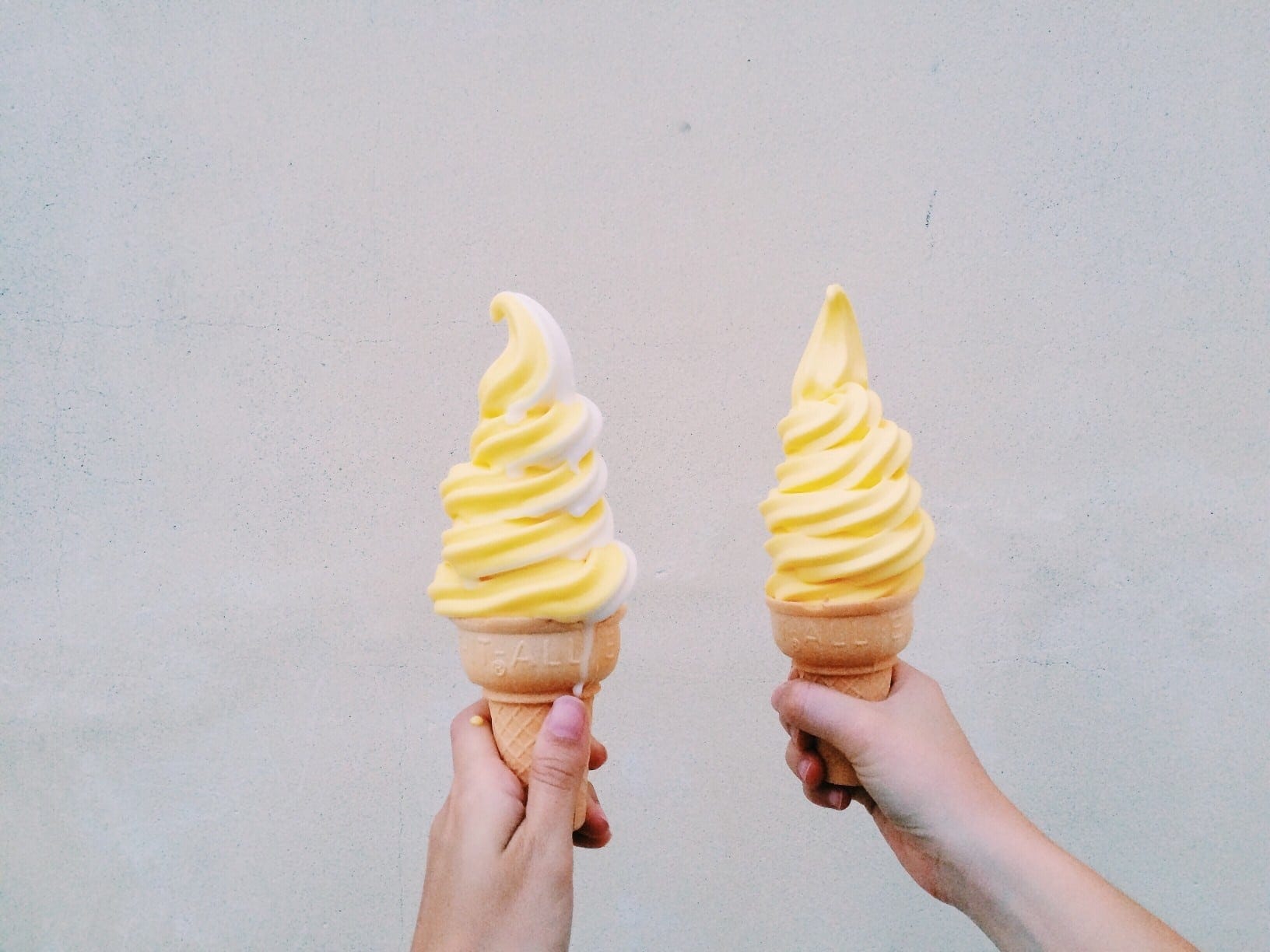 Disney shares iconic Dole Whip + churro recipes and we couldn’t be happier two hands holding dole whip