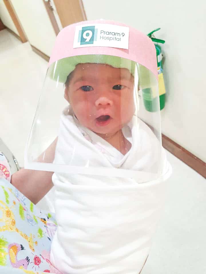 Babies in this hospital are wearing tiny face shields to protect them during the pandemic baby wearing a tiny face shield