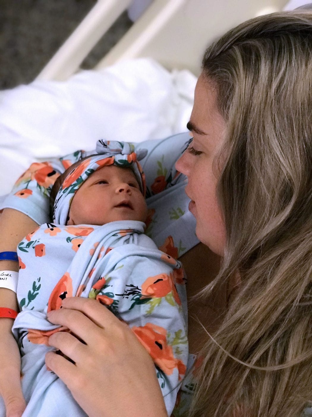 Delivering a baby during a pandemic turned out to be a blessing in disguise mom looking at newborn baby