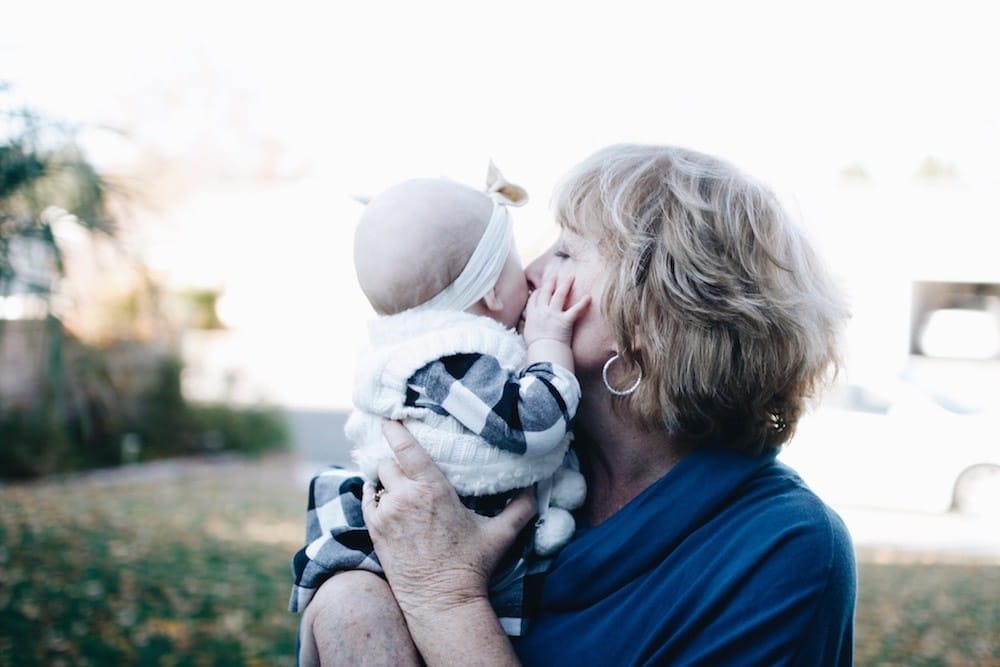 Thank you, Mom, for being such a lifesaver after I had the baby grandma kissing baby on the cheek