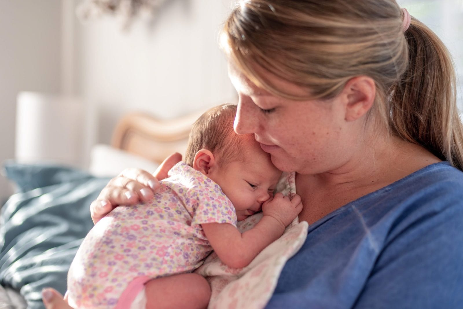 The three words all new moms need to hear new mom patting newborns back