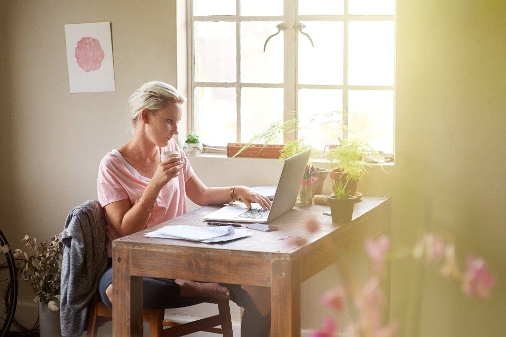 Twitter is allowing their employees to work from home forever woman working from home