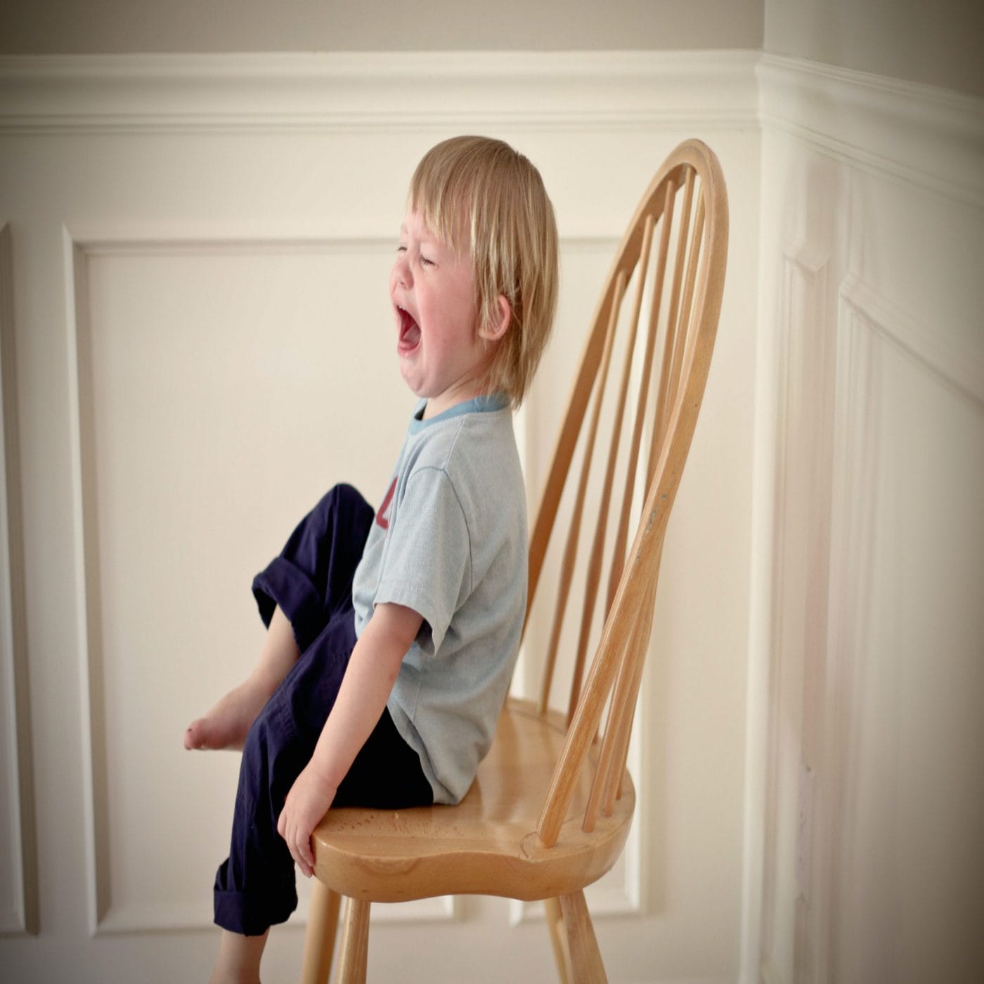 If your kids are regressing, it’s normal child screaming in a chair