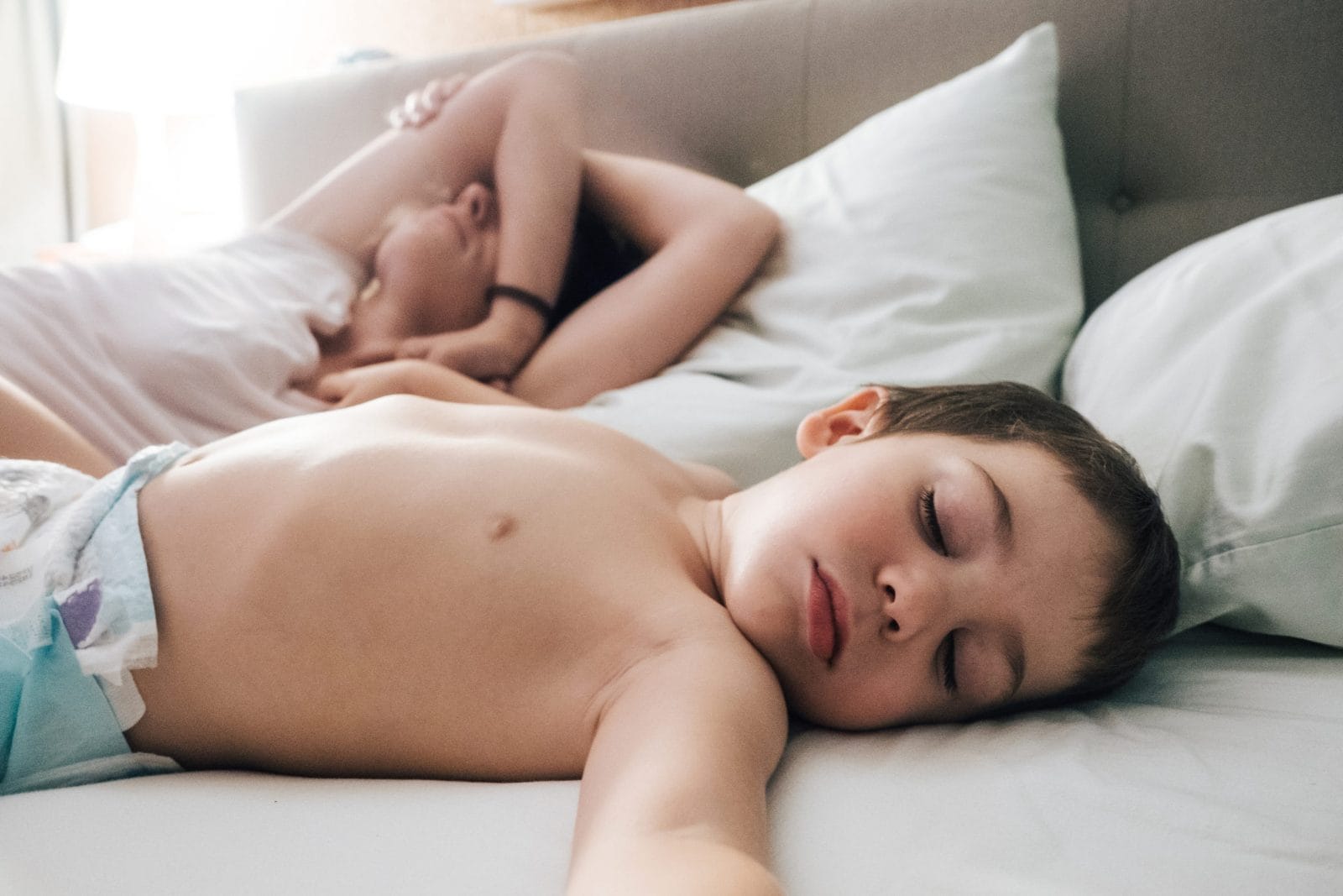 We wanted more sleep, so we tried this little boy sleeping in bed next to mom