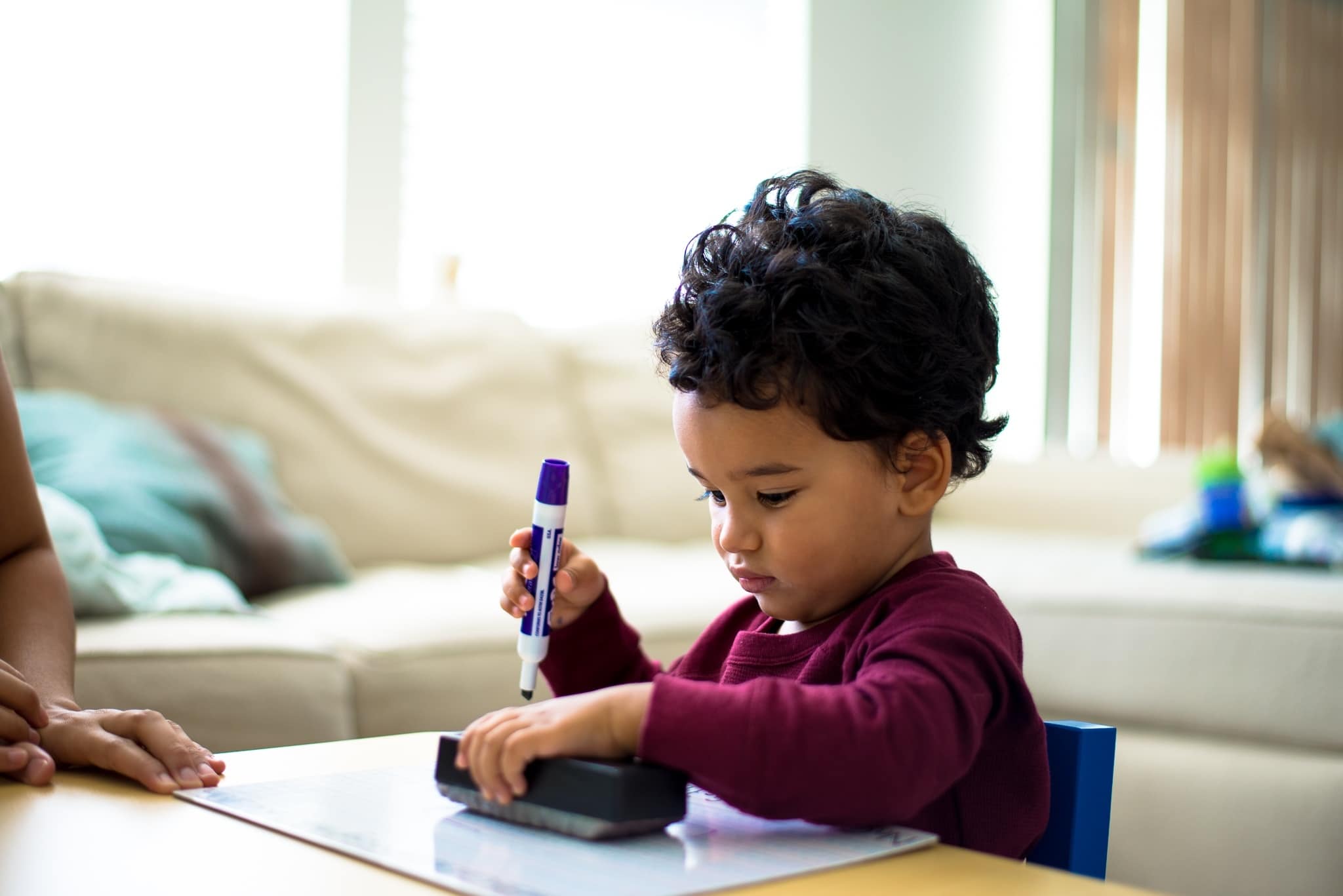I’m sending my toddler to daycare for the first time—but I’m not ready little boy coloring