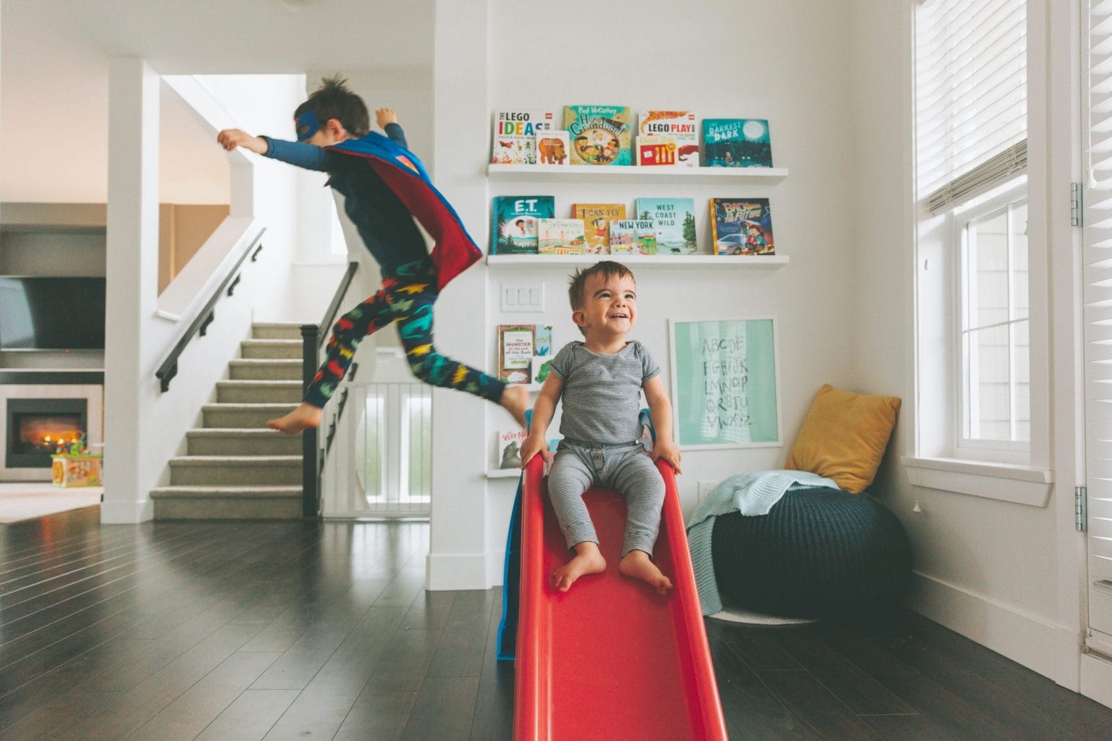 Summer activities are canceled, but the magic of the season isn’t siblings playing on a slide