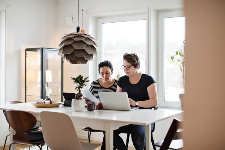 Doing taxes? What every mama should know for filing in 2020 parents working on a computer together