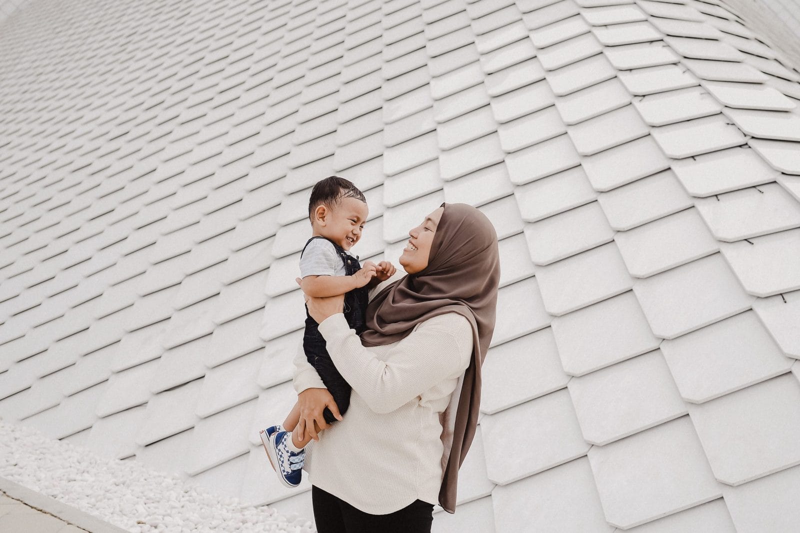 The baby milestones app no one talks about mom holding toddler