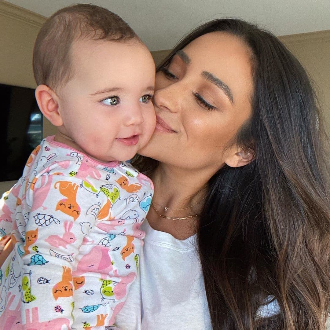 Why Shay Mitchell is teaching her baby about activism Shay Mitchell kissing daughter on the cheek