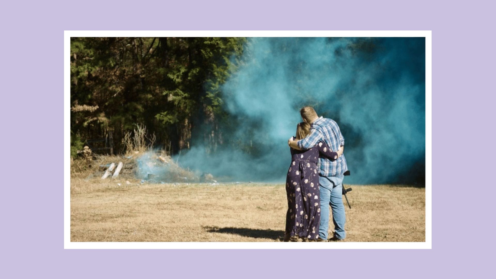 Another gender reveal gone wrong—is it time to finally retire this trend? couple overlooking blue smoke for a gender reveal
