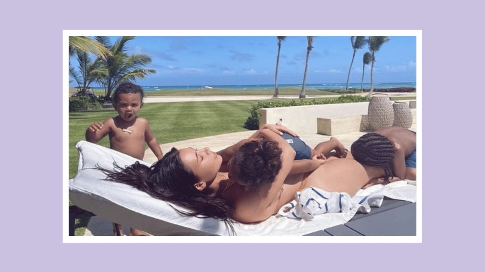 Kim Kardashian is every mom just trying to get some “me time” in these cute family pics Kim Kardashian laying out with kids climbing all over her