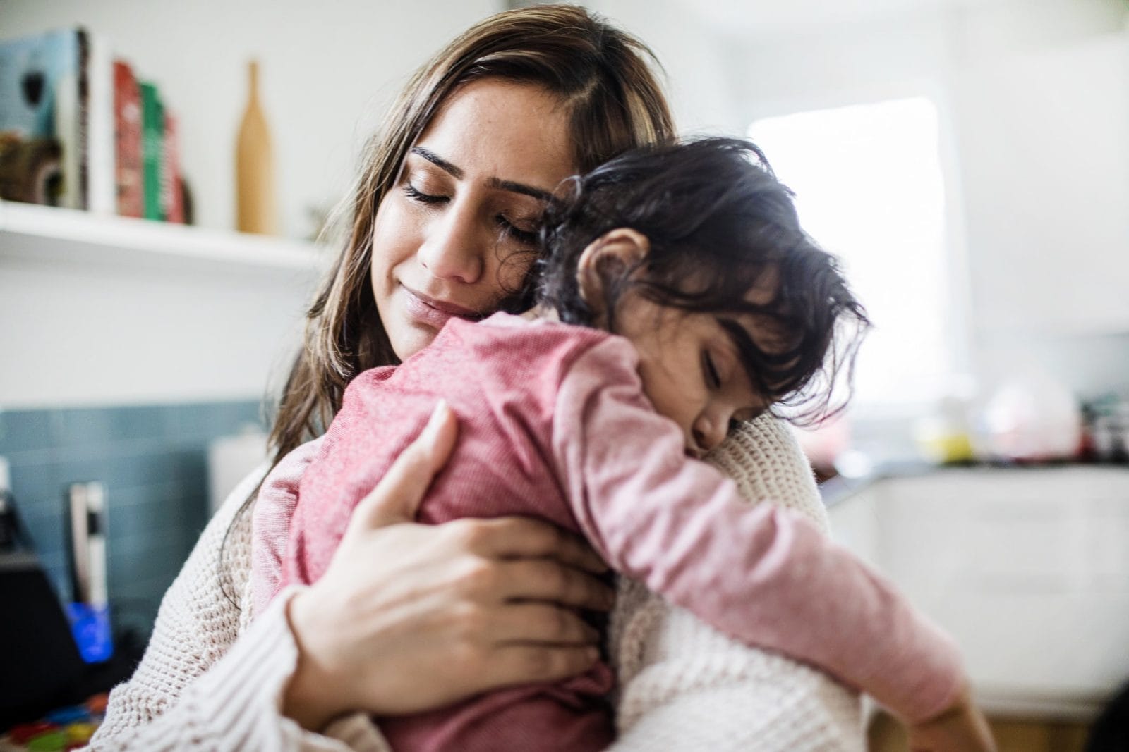 How hugging defuses a tantrum—almost every time mom hugging toddler