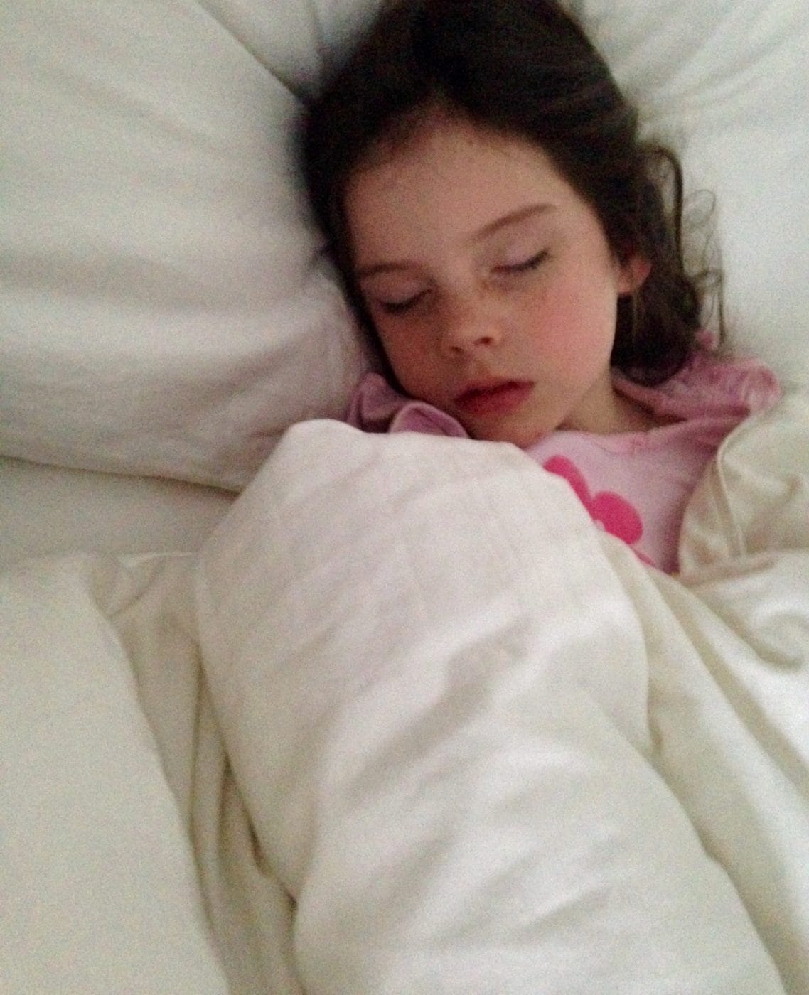 My kids’ first cold of the pandemic school year was a nightmare for our family little girl sleeping in a bed