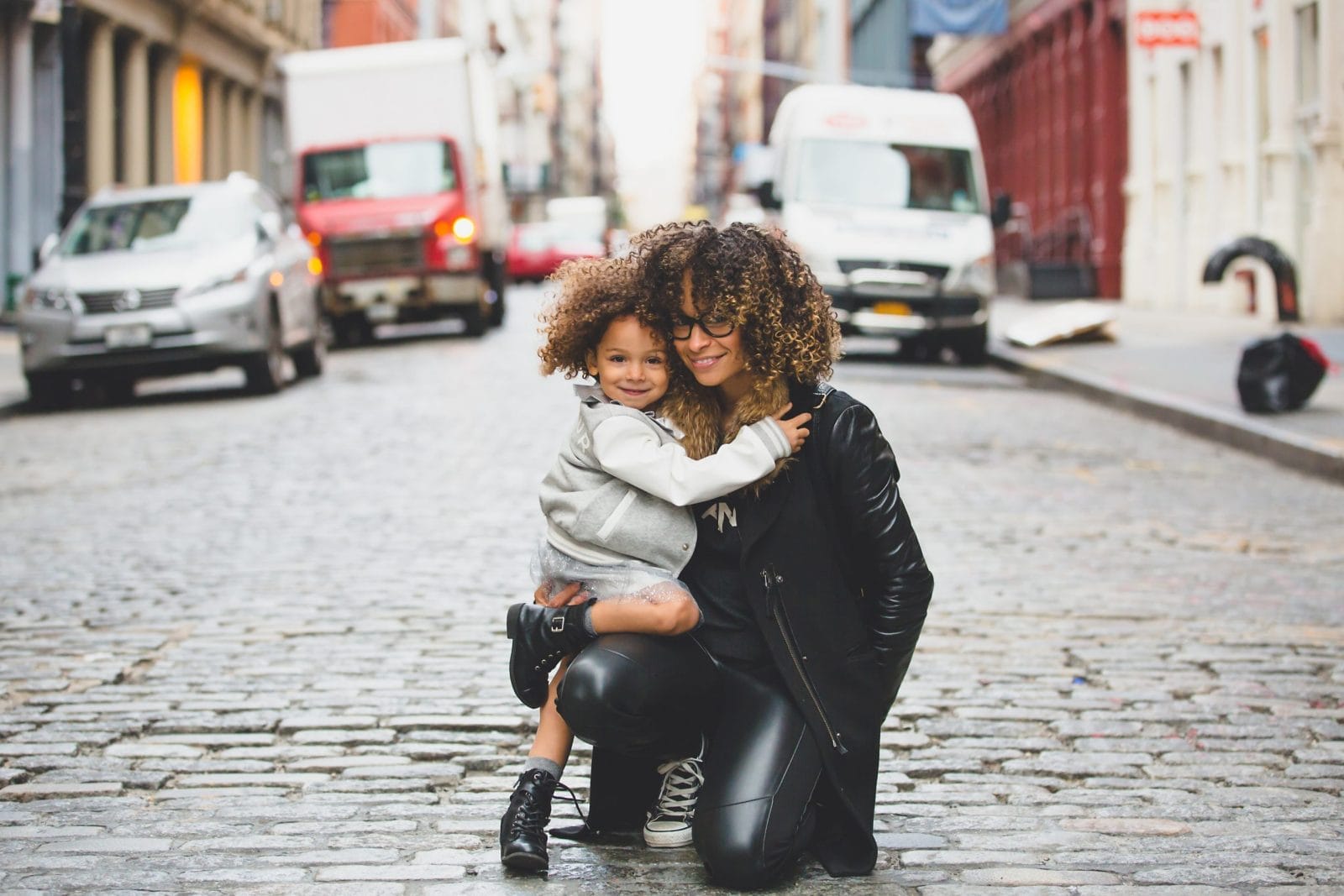How to raise girls who lead mom and daughter hugging on the street