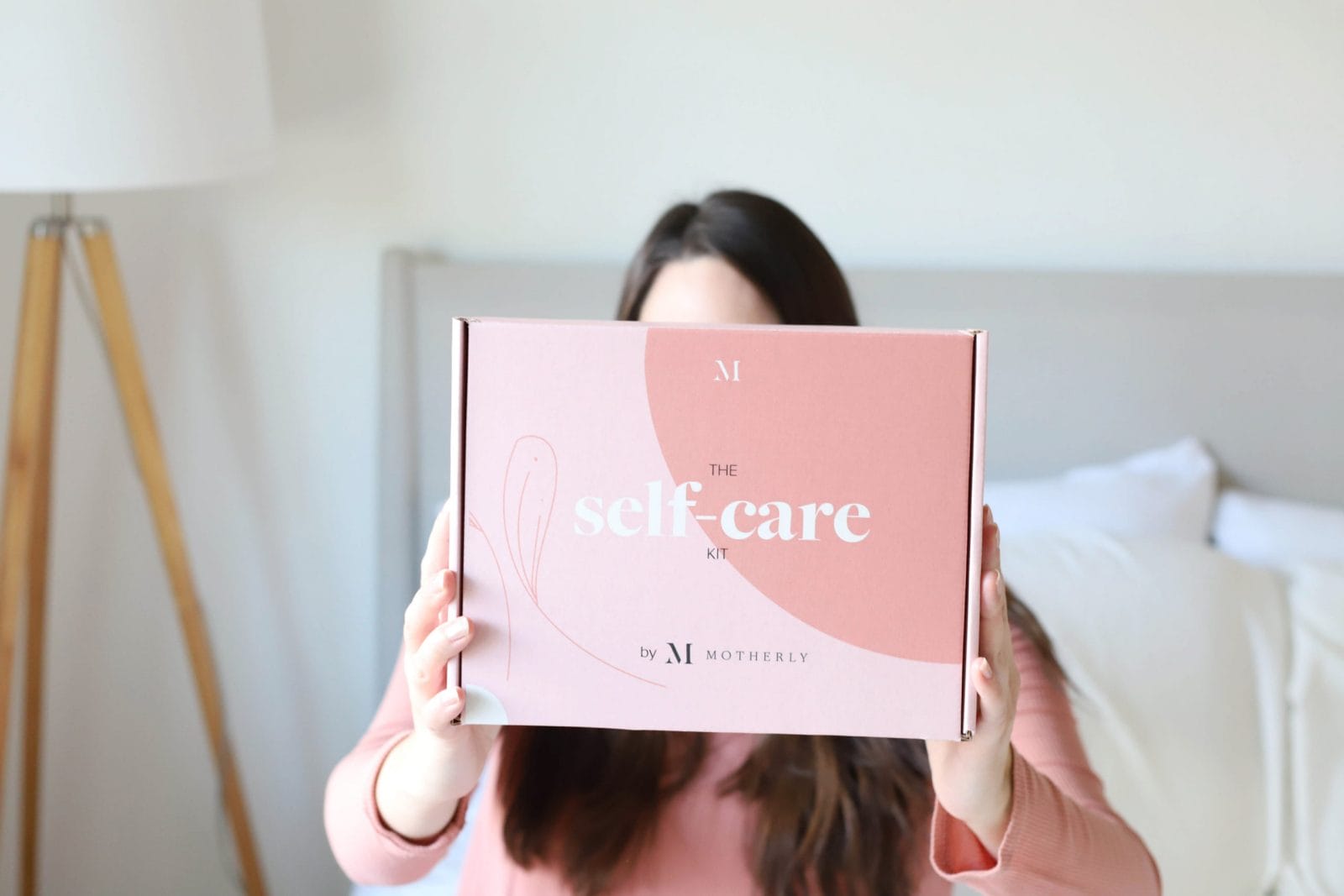 The Self-Care Kit by Motherly is here woman holding self-care kit