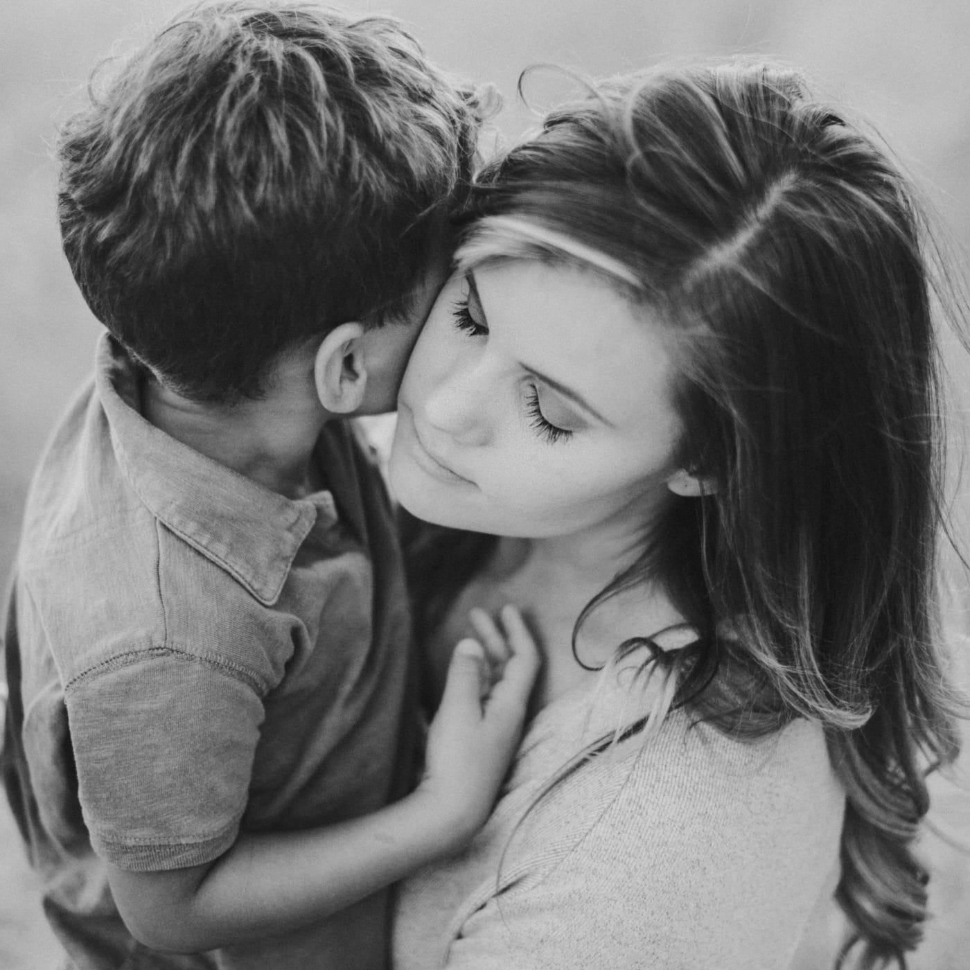 How to cope with grief when your kids are grieving, too mom hugging toddler