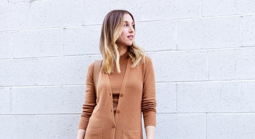 Whitney Port is talking about how her second miscarriage was different Whitney Port posting in a cardigan