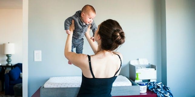 6 mom hacks to make your life much easier mom holding baby in the air