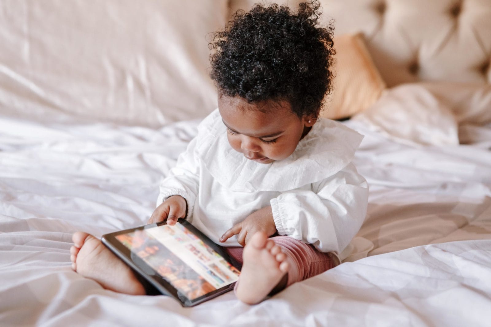 This viral TikTok shows a phone hack every parent needs to know baby playing on a tablet