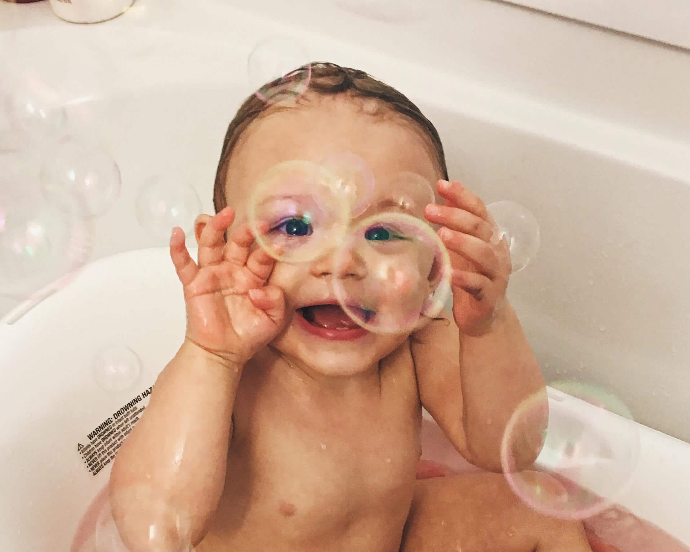 35 Pisces-inspired baby names for your little fish child in the bath tub playing with bubbles- pisces names