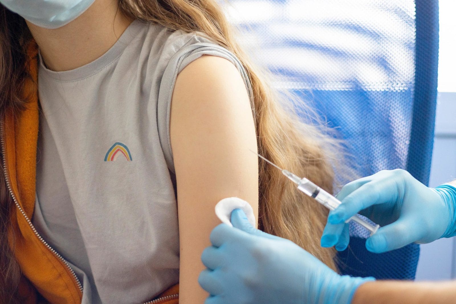 Pfizer says its Covid-19 vaccine is 100% effective for kids in this age group teen getting a shot