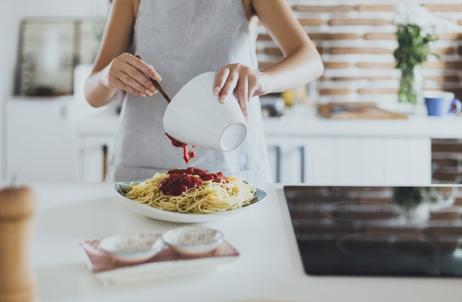 Making dinner just got a little more fun with Barilla’s new pasta playlists woman cooking pasta