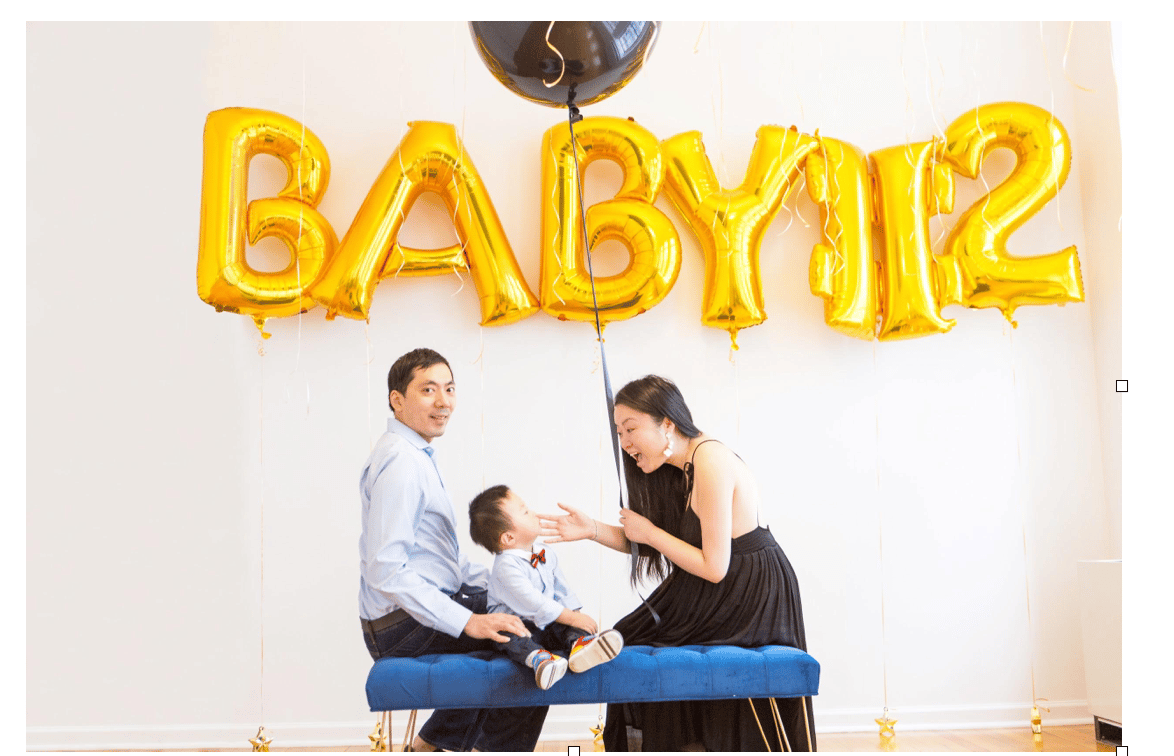 I’m pregnant with baby #2, working a job and a side hustle, and I still feel like I’m not doing enough parents and baby behind balloons that read "baby #2"