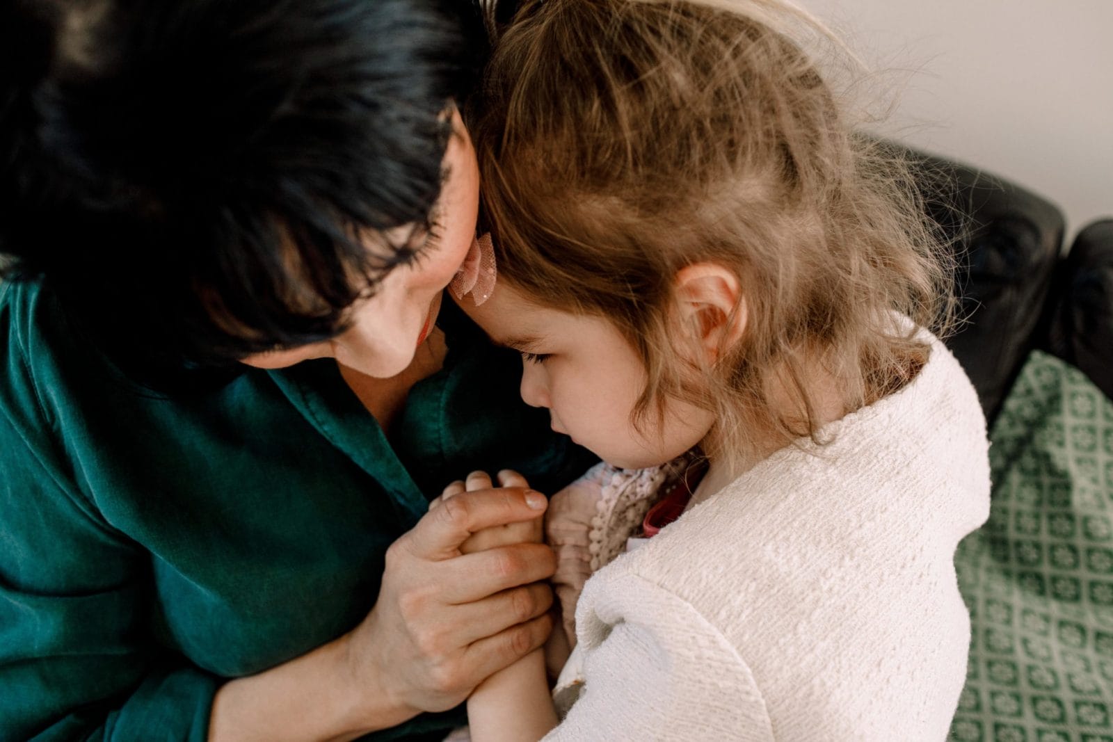 As a mother, sometimes soothing your child’s pain means facing your own past traumas mom comforting her daughter