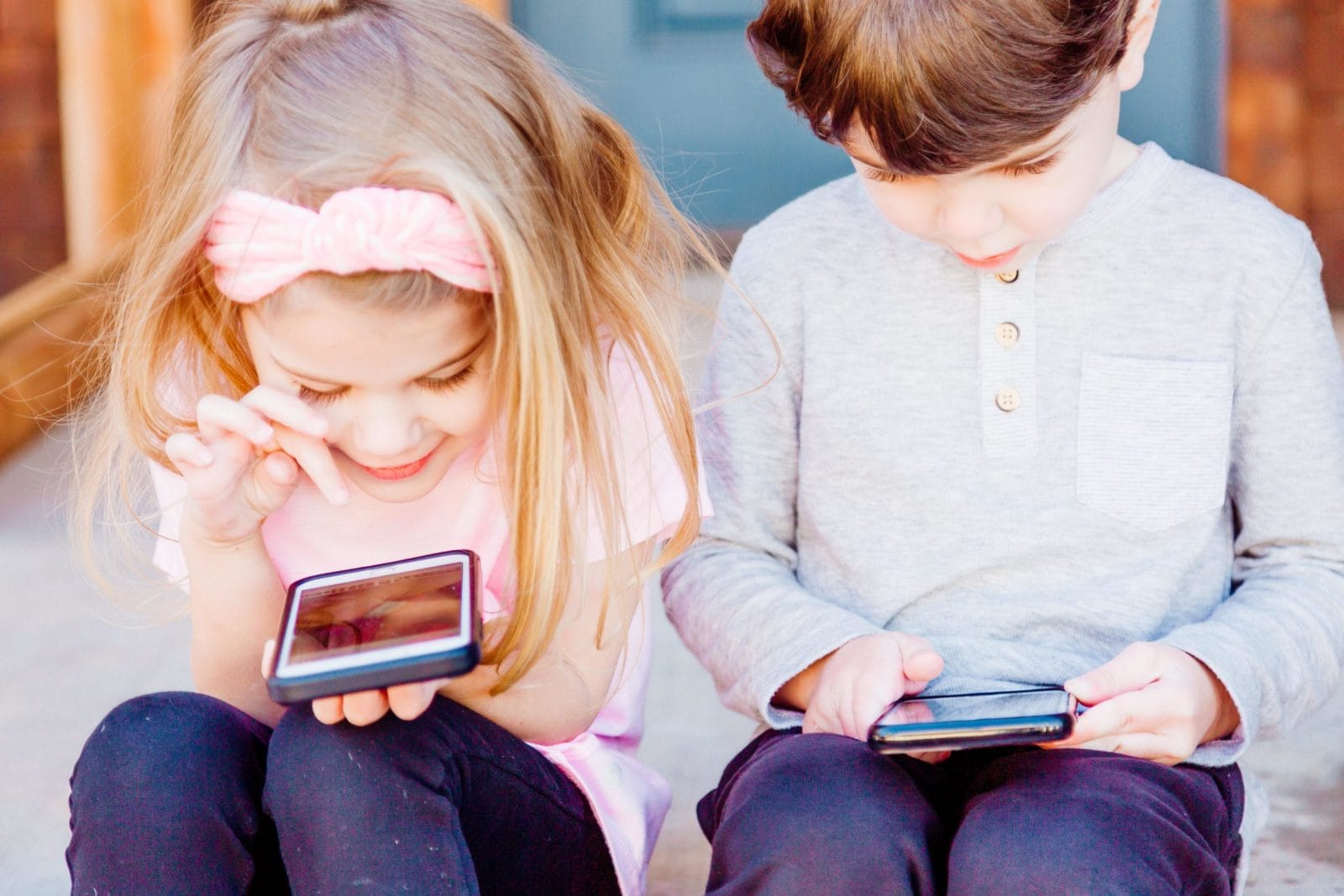 Facebook should cancel Instagram for kids plan, State AGs say little kids playing on phones