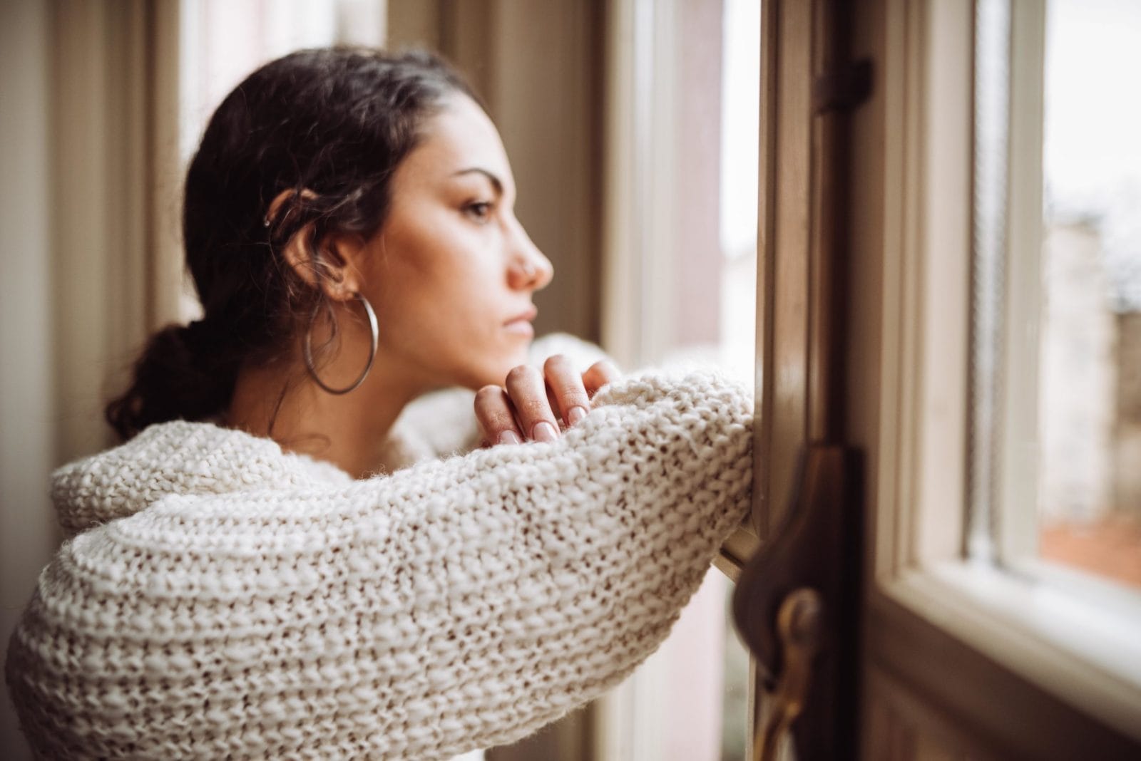 Women with this common condition have a higher risk for COVID-19 woman looking out window