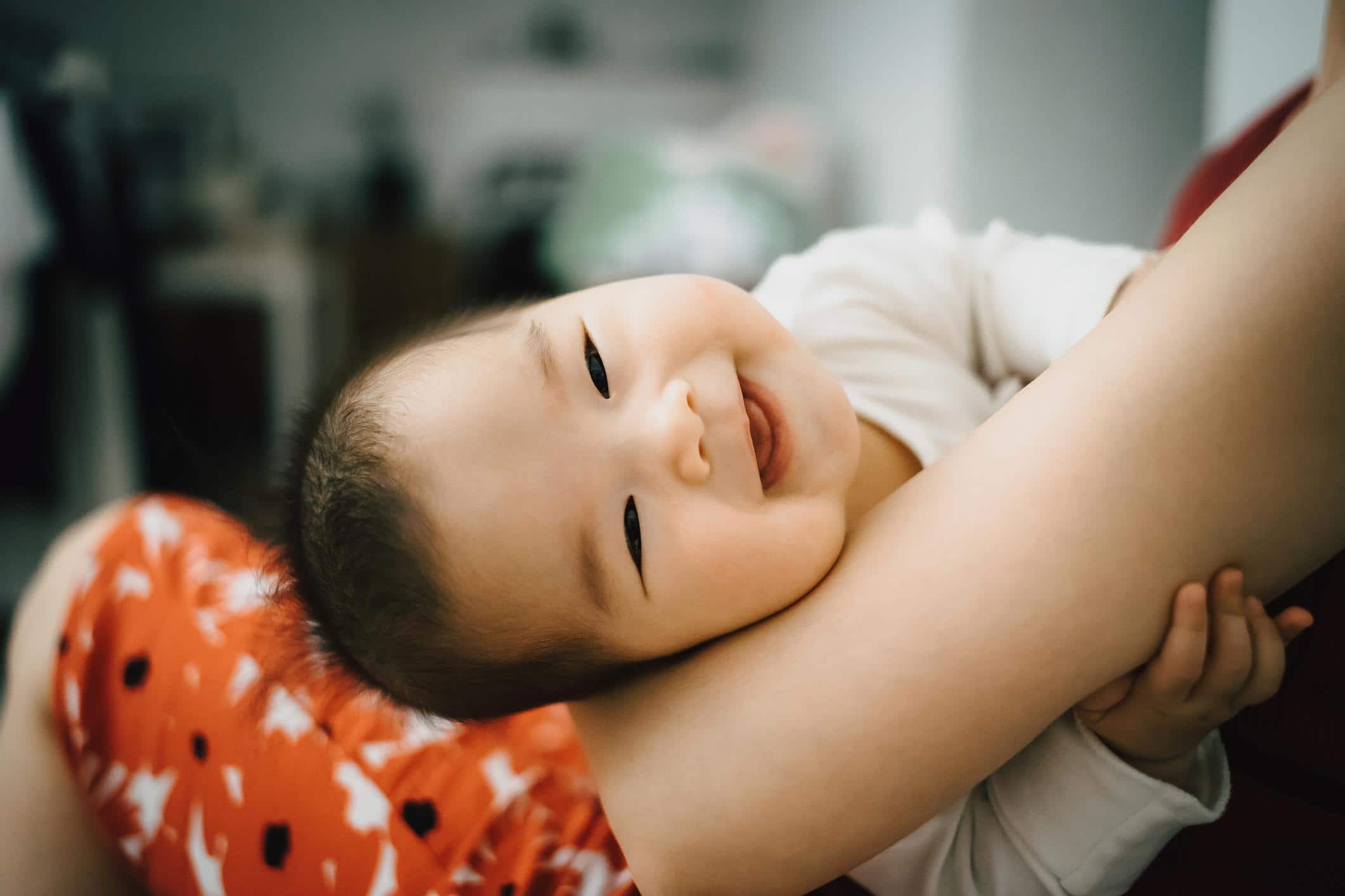 20 May baby names that reflect strength and perseverance cute baby laying on moms arms- may baby names