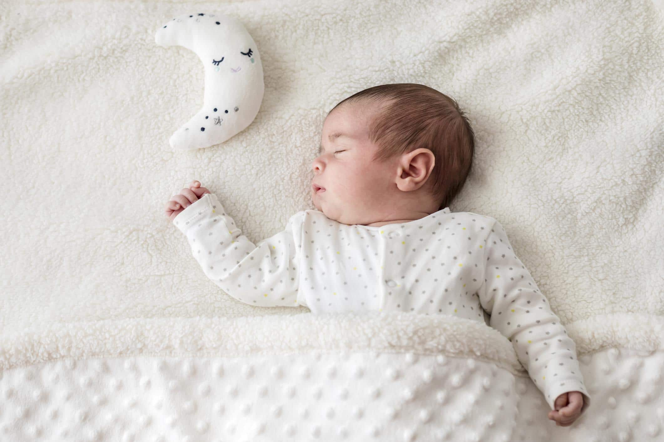 75 Cancer zodiac baby names for June & July babies sleeping baby with moon pillow- cancer zodiac names