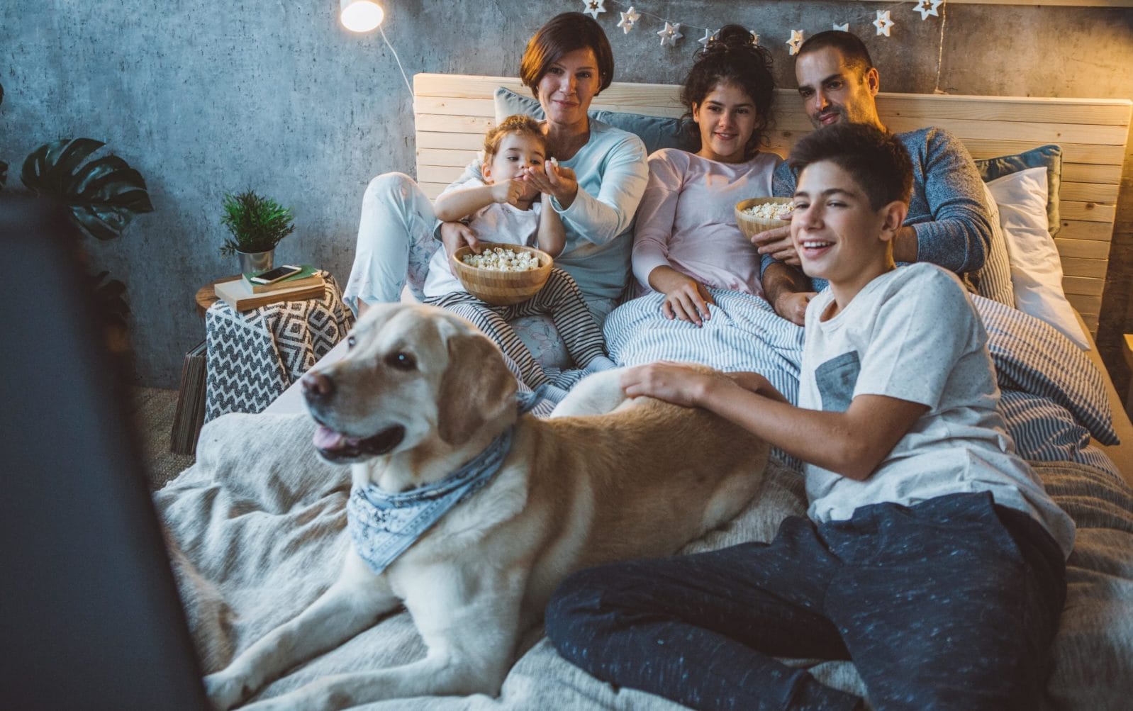 9 family-friendly movies coming out this summer family watching a movie on the couch together