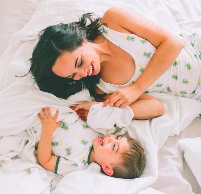 Yelling doesn’t work—5 tactics to try instead mom and son laughing on a bed