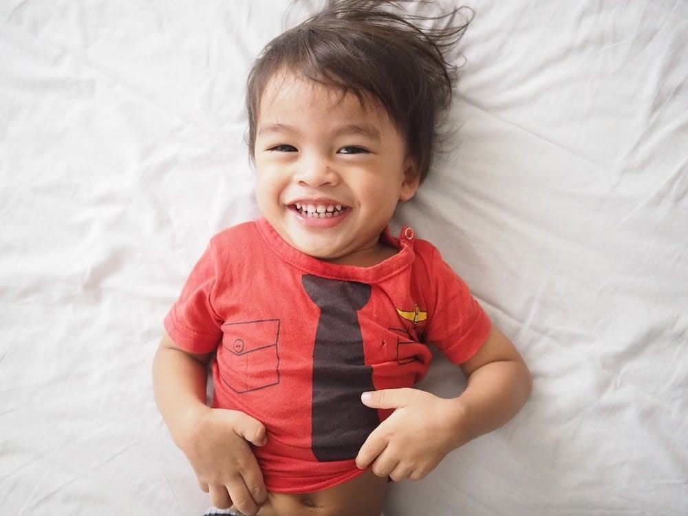 7 secrets of highly happy kids happy kid looking at camera